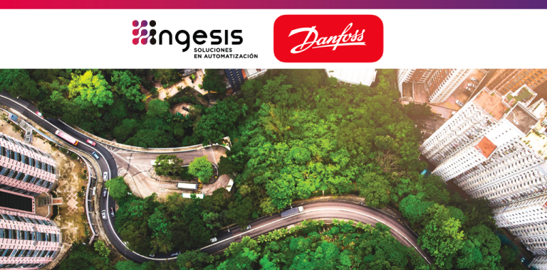 Vista aérea de entorno urbano y zona verde para ilustrar la eficiencia energética con variadores de frecuencia Danfoss